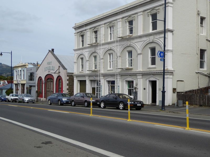 This is the former Royal Hotel from 1880, along with stables from 1867. The hotel's arcade was once open, with iron railings overlooking the