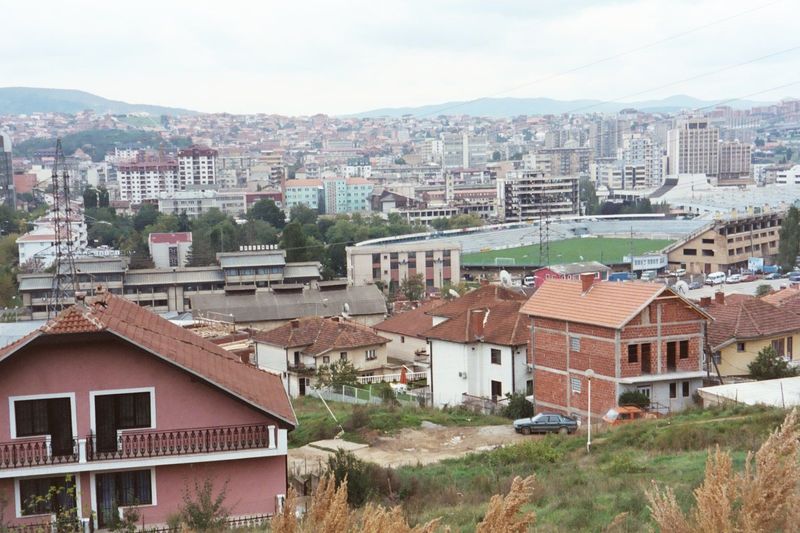 The sports stadium; behind it, the town center.