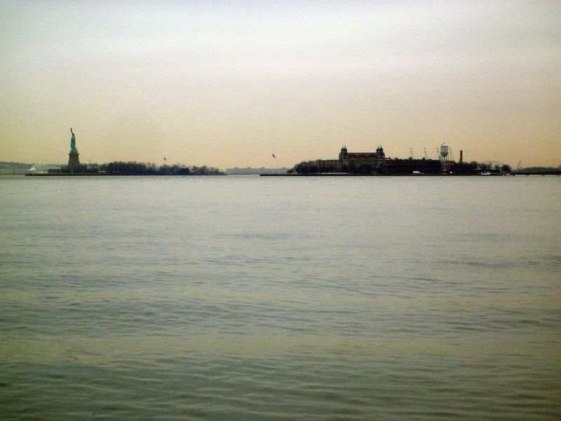Across the water, the Statue of Liberty and Ellis Island.