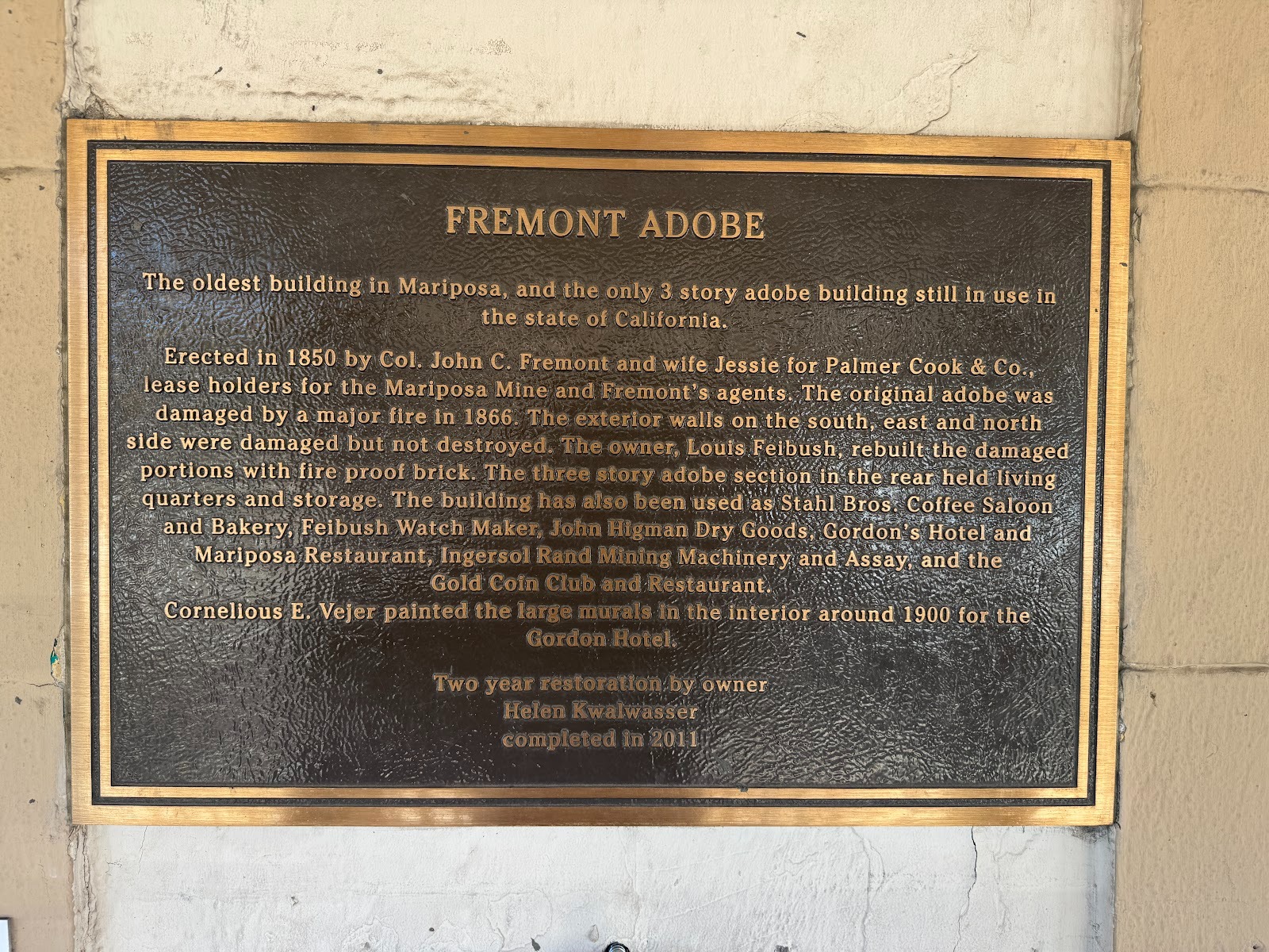 A helpful plaque on the exterior of the building.