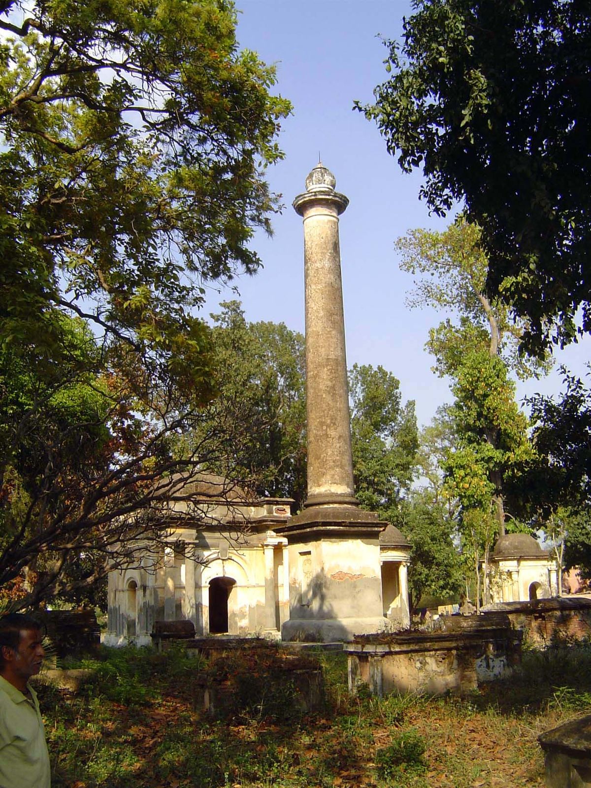 A few blocks away is the cemetery. Who's under the column?