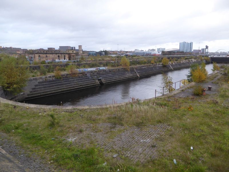 Another view of the graving docks. Beyond the gate at the far end there's an arch; it's a bridge over the river.