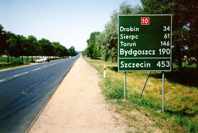 Northwest of Warsaw and Plonsk, a fine highway zips through that countryside toward Stettin, the old German name for a city in the western a