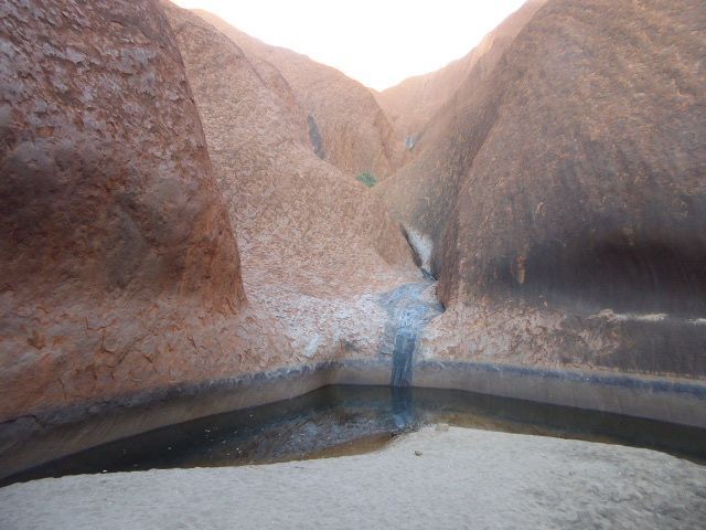 Here's the pool. Harney writes: "To the Uluritdja, the mountain symbolises their tribe and held the essence of life in the rock pool of Ulur