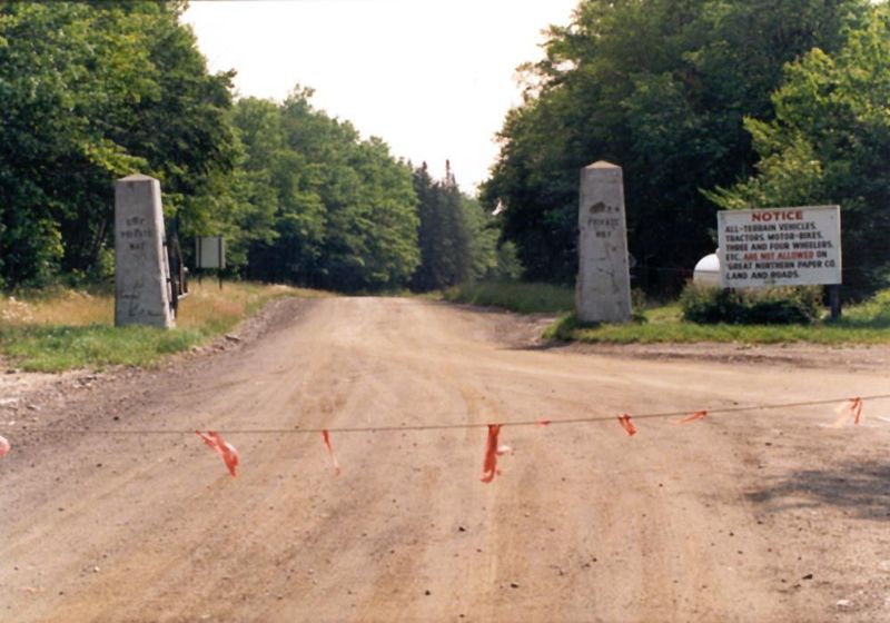 An entrance to one of the private roads. These roads operate year-round, despite the long winter. Trucks lose traction on ice only at winter