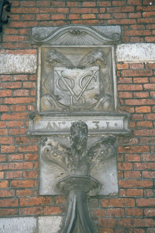 Street level on the same building has a plaque with the initials VOC:D. Translation: United East-Indies Company: Delft Chamber. The VOC's ot