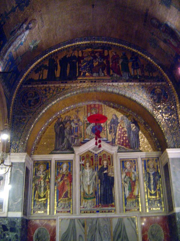 Several chapels hint at what might be done. This is the Chapel of St Gregory and St. Augustine. In the central panels Augustine stands in a 