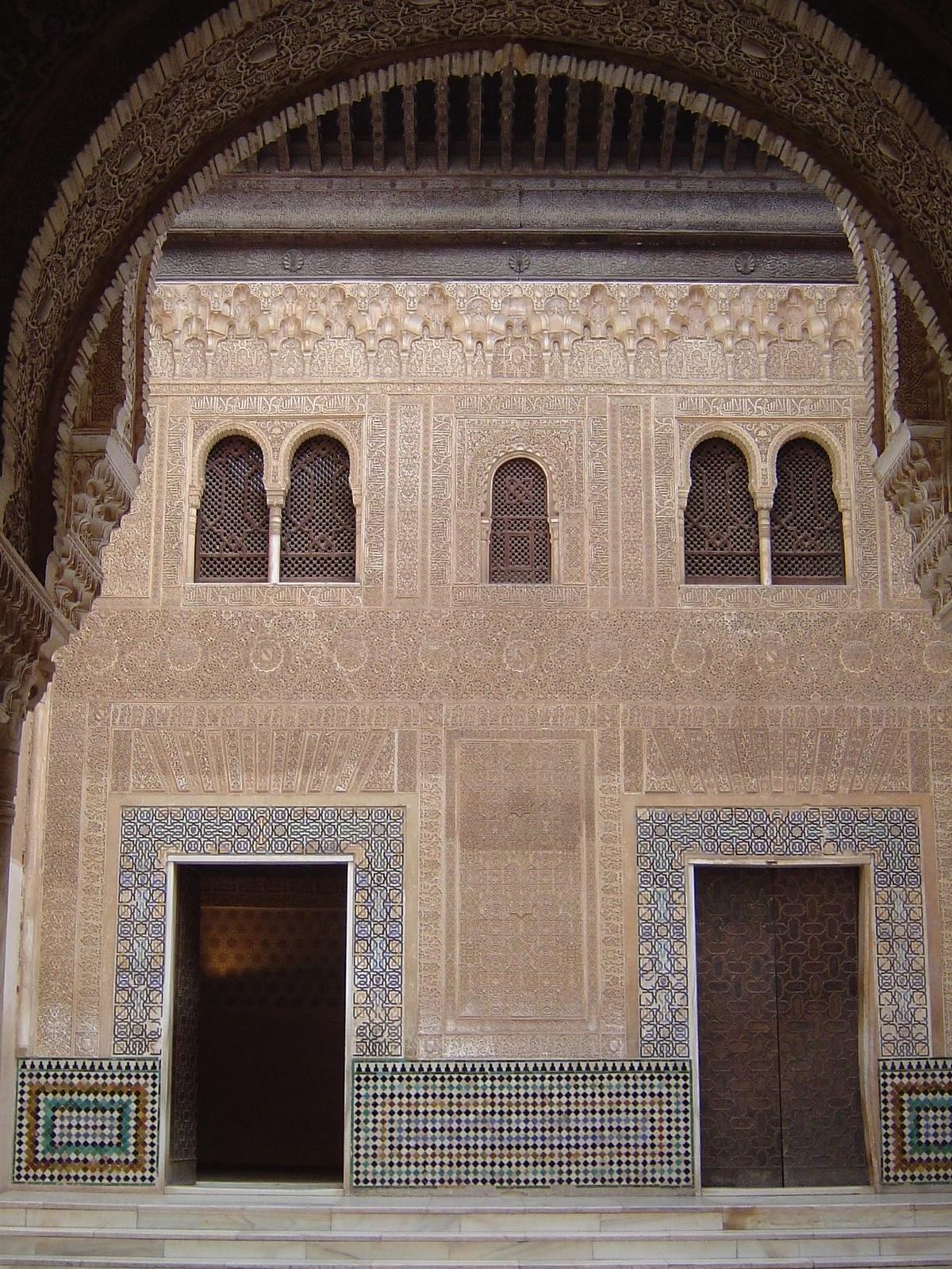 The south wall of the Patio del Cuarto Dorado. This was once the facade of the palace's main entrance. It's hard to make sense of that fact,