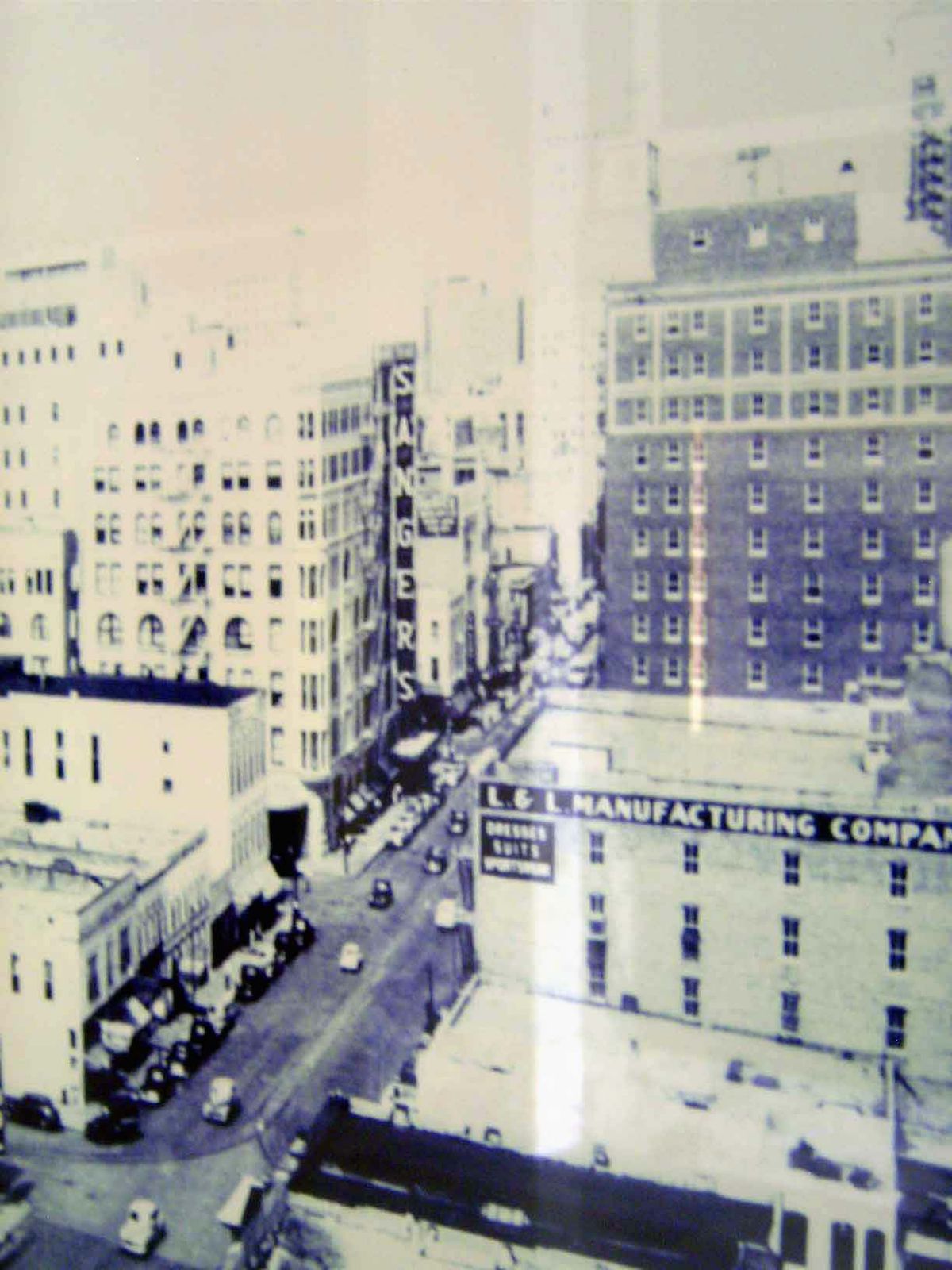 A view about the same time of Lamar Street, with Sanger's prominently signed.