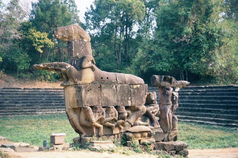 Between the heads of the two serpents there is a horse to which men cling. This is Balaha, a manifestation of the Compassionate Buddha, Aval
