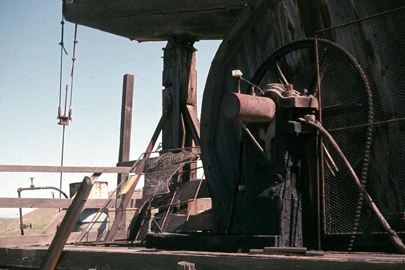 Close up of the motor-driven drive chain and the huge band or balance wheel. The speed of rotation was slow, even dignified.