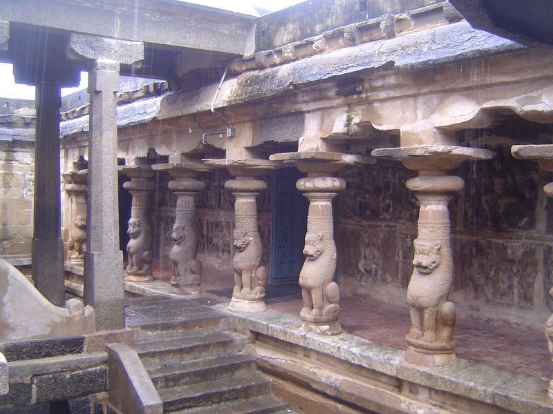 We've begun walking around the prakara and here look back toward the entrance; if we had gone straight ahead we would have crossed the bridg