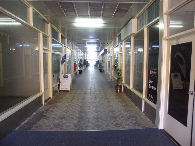 Here's the ground floor now, cut up into ten mostly vacant spaces for shops or offices.