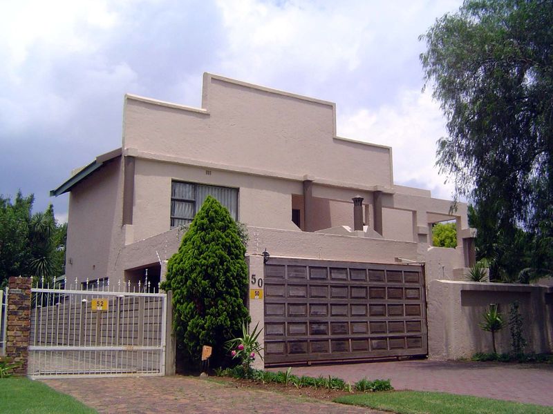 A house that presents an electrified wall to the street. The house itself does a fair imitation of a bunker.