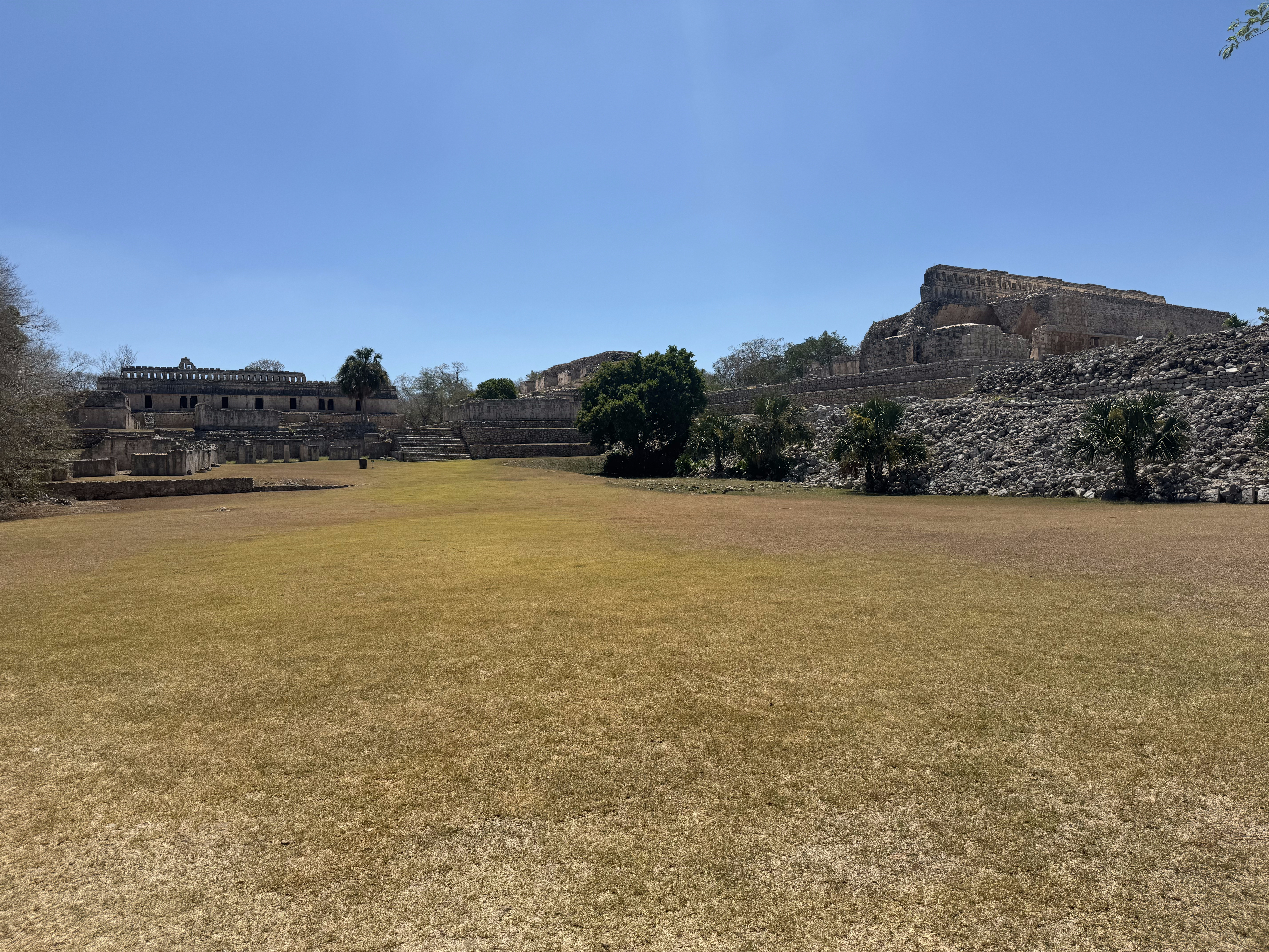 Kabah's central courtyard is framed by a palace complex on the left and, on the right, by the Palace of the Masks, also known awkwardly in E