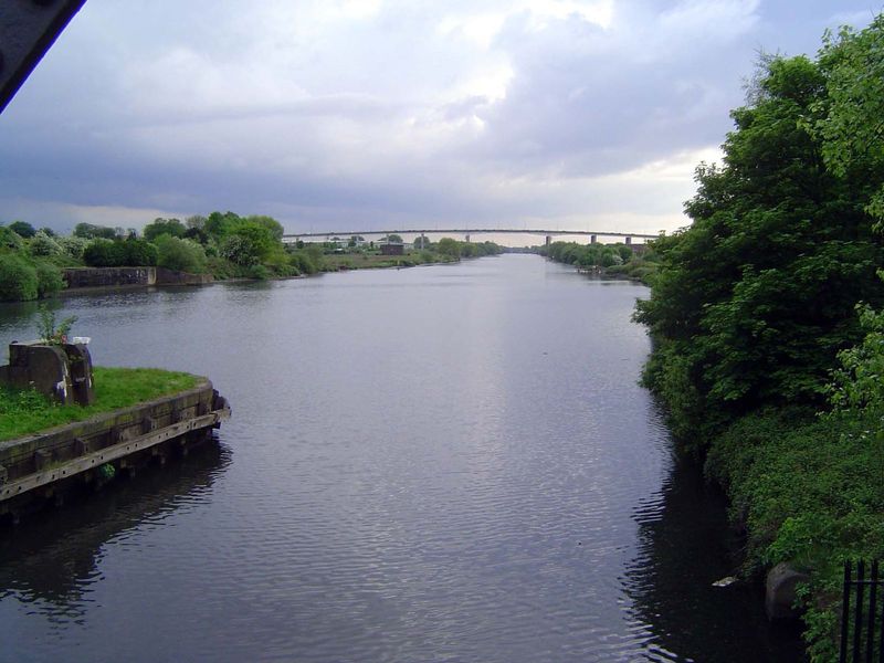 This is the Manchester Ship Canal at Barton upon Irwell, a few miles west of Manchester. In the distance is the M60 ring road. The Canal car
