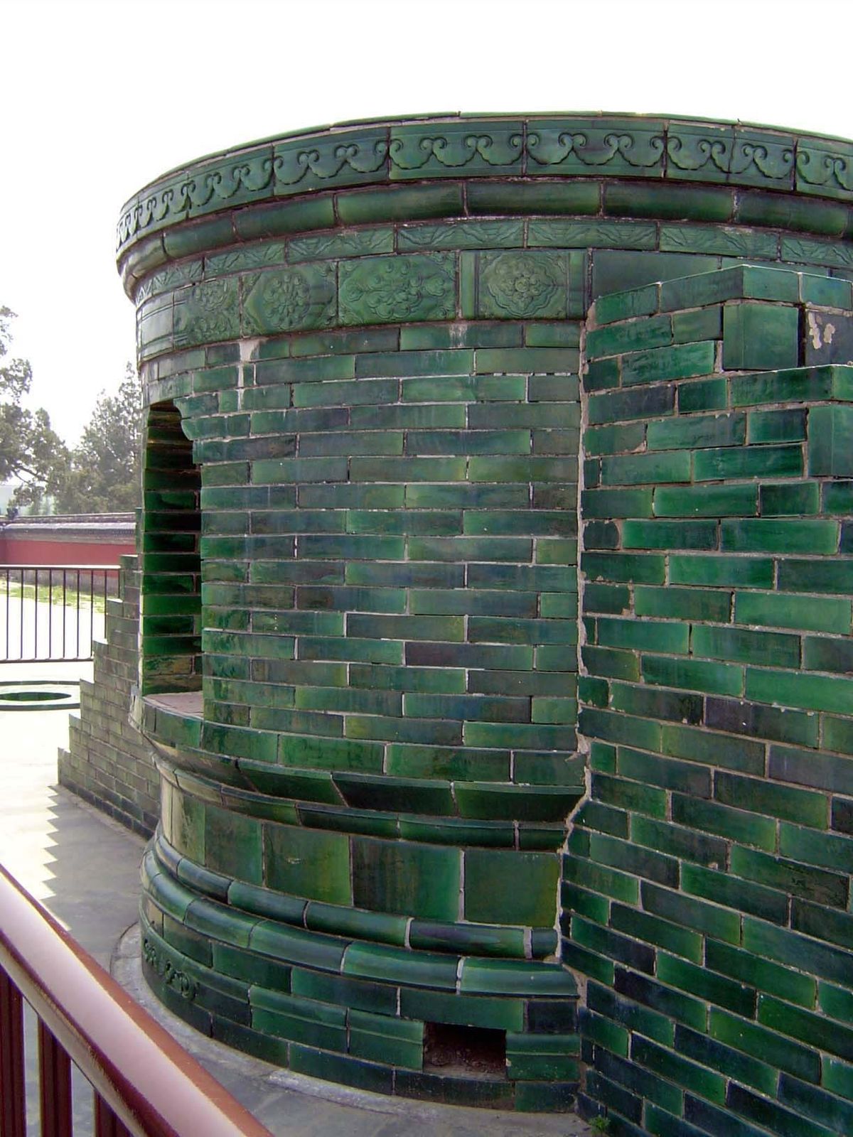 Off to the side is the glazed-tile oven atop which the sacrificial oxen were roasted on a grill.

The glazing is a reminder that the altar w