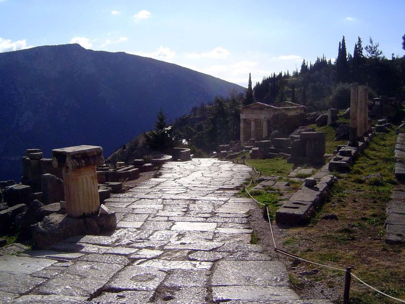 A patch of the sacred way. The building on the right is the reassembled Treasury of Athens, the only building that has been reassembled. Tha
