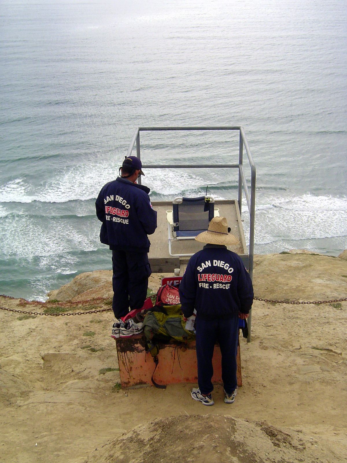 High above the water, lifeguards are in radio contact with guards on the beach below.