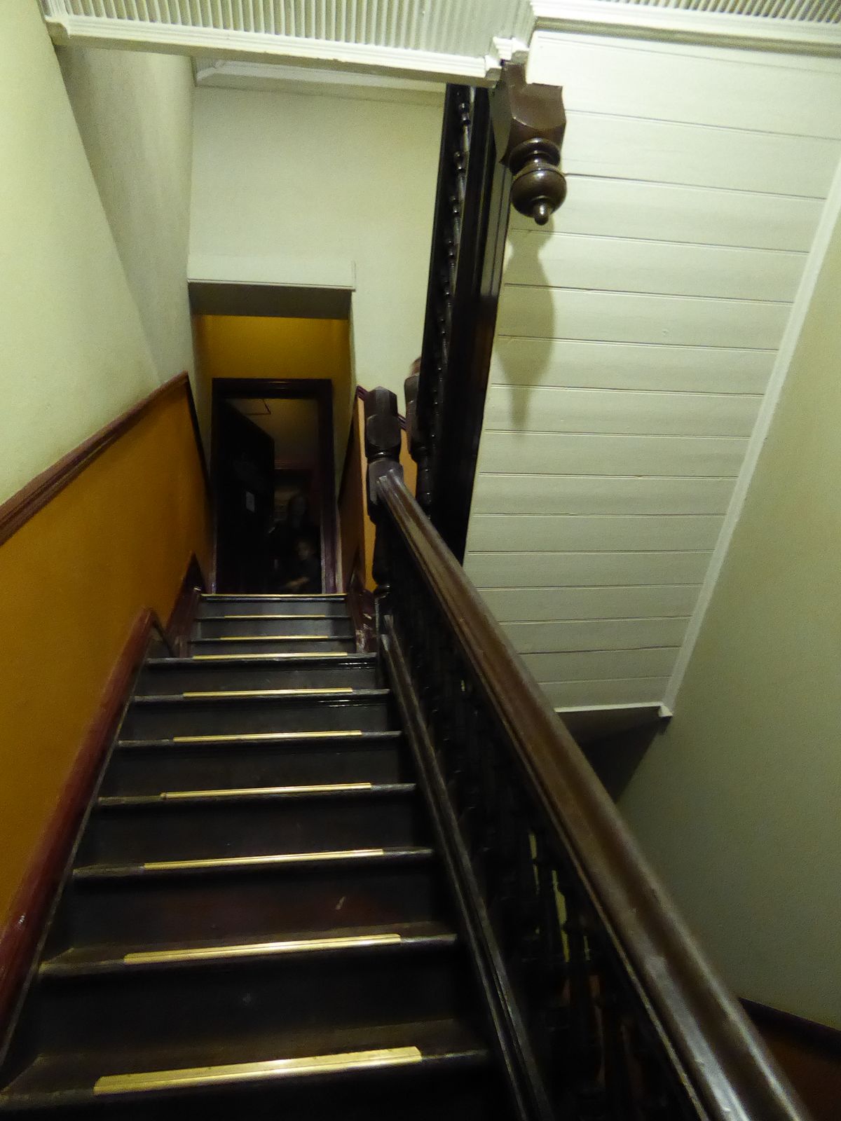 The building is about as narrow as can be, but we're after something upstairs.
