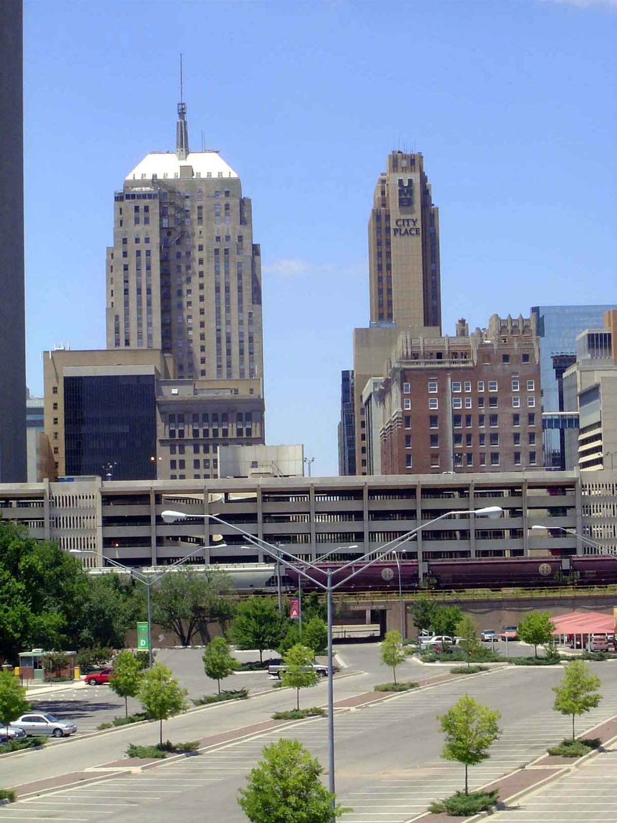 The parking lot in the foreground is on the site of an old railroad yard. A track ran straight through what is now a multi-story parking gar