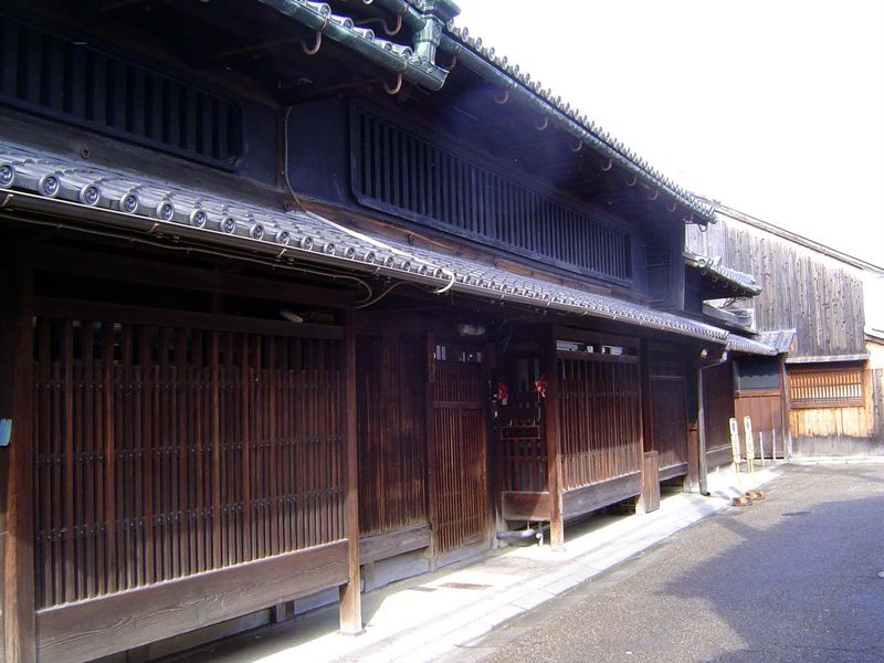 Wood slats, or koshi, deflect prying eyes while allowing residents to see the street.