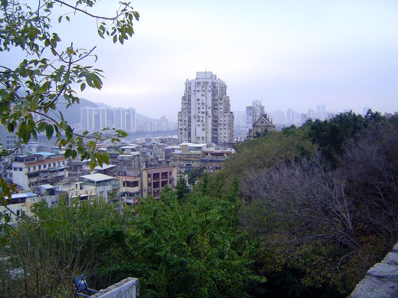 The pediment of St. Paul's peeks over the trees that have grown up around the base of the Fortaleza do Monte or Mount Fortress, built by the