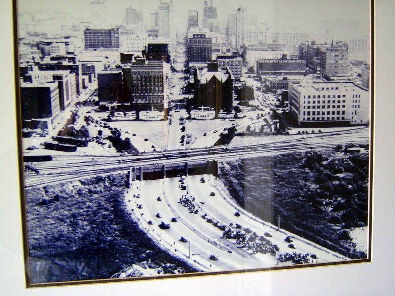 An aerial view from the 1930s, showing U.S. 80 coming east from Fort Worth and splitting at Dealy Plaza into Elm, Main, and Commerce. The sc