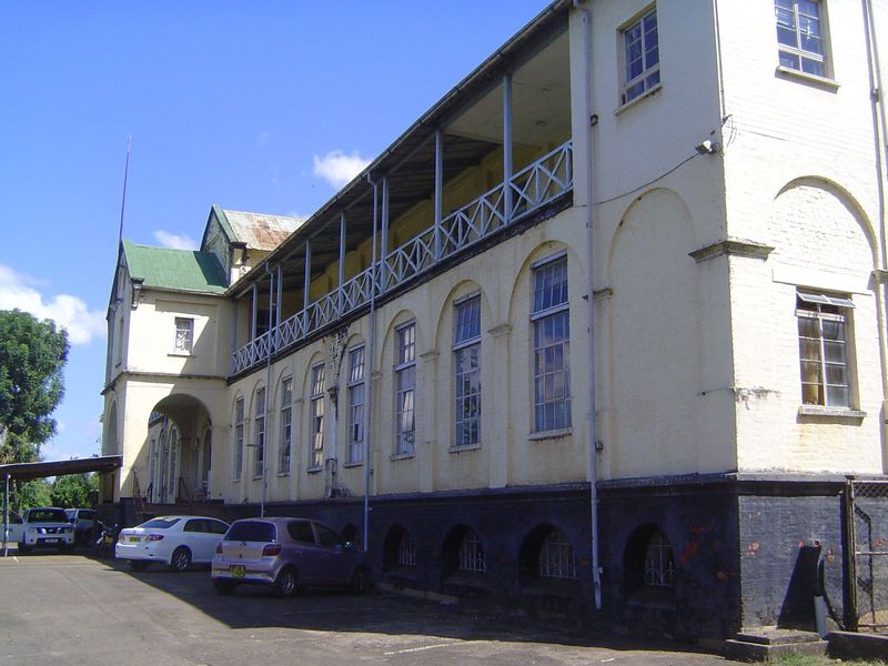 A single-story building was put up in 1897 for government offices. It burned in 1919 and was not replaced until the larger building shown he