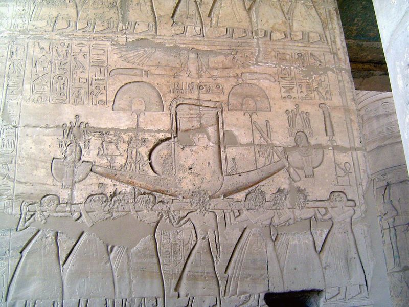Priests carry the sacred barque.