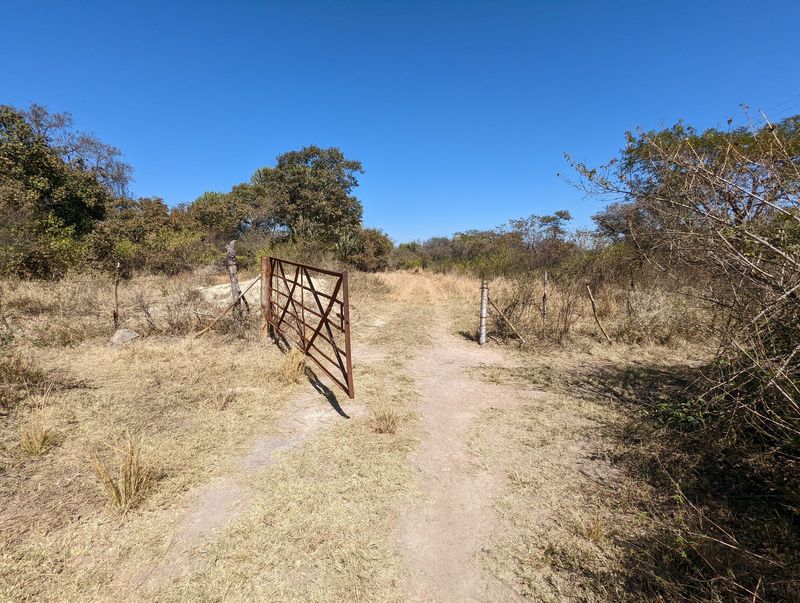 The gate was hooked shut with a loop of barbed, so either we opened it or turned around. We opened it. Now we just have to find a stick to p