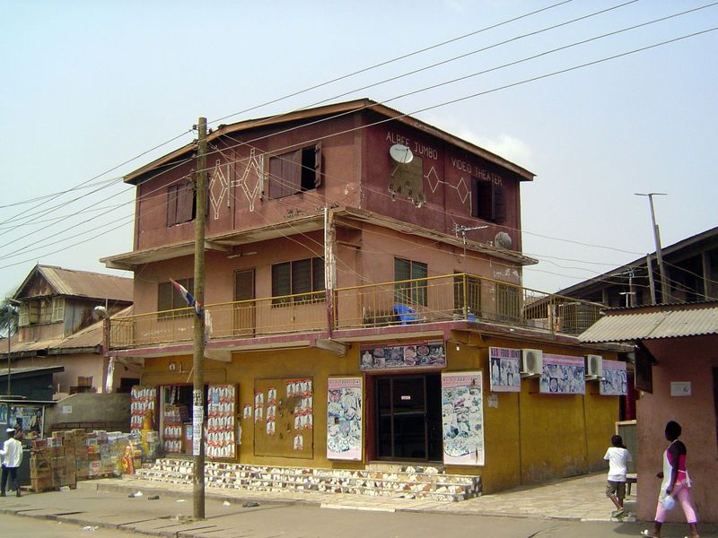 Its neighbor: stacked blocks, with shops below.