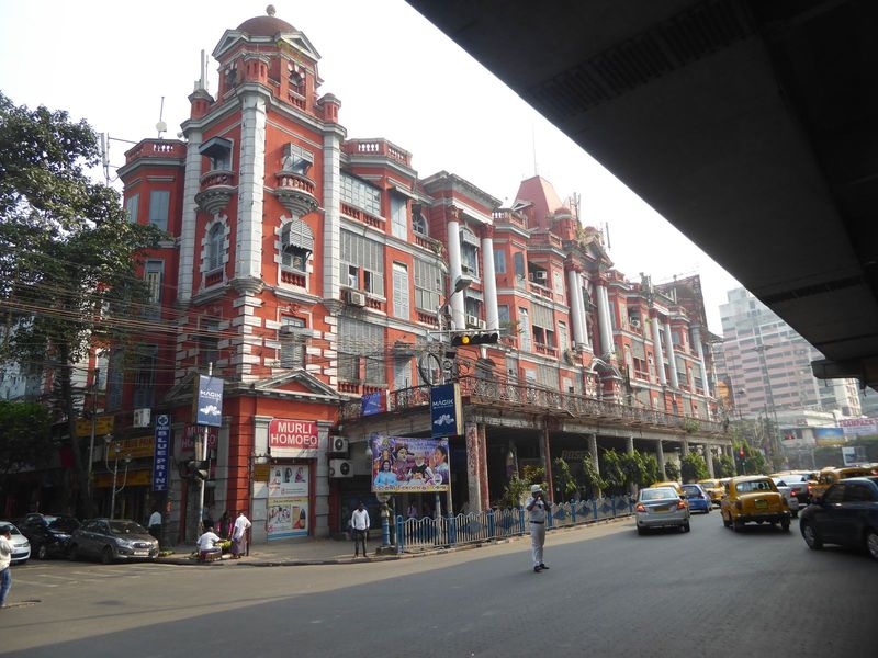 Here's a bit of the flyover for you, but the building whose tenants get a first-rate view of it is Chowringhee Mansions from 1907, a project