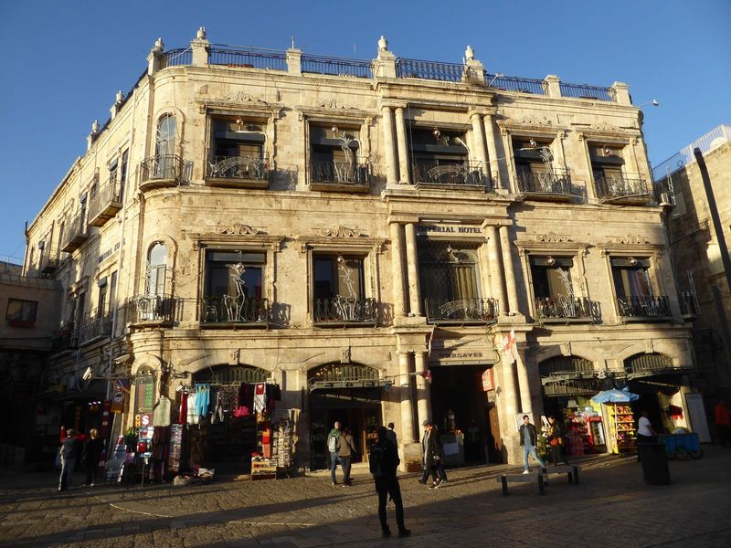 We're returned to enter the Old City at the Jaffa Gate, where the afternoon light is kind to the Grand New Hotel of 1884. It's the Imperial 