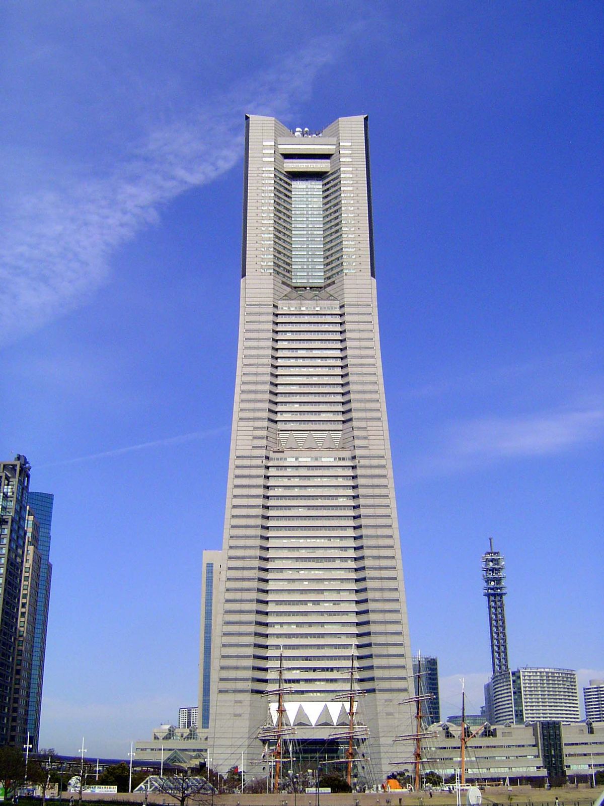 Dwarfing the ship, the Landmark Tower was among the last projects of Hugh Stubbins, Jr., a Harvard professor better known back home for Manh