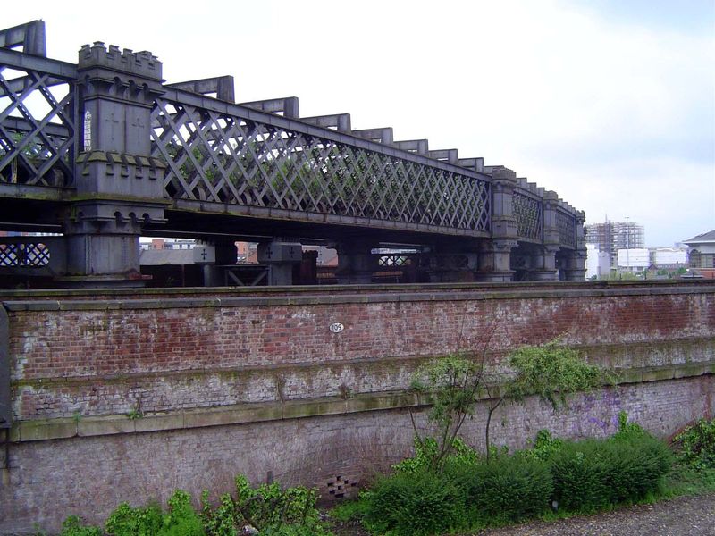 A closer view of the Cheshire Lines viaduct, which despite its reliance on iron insists on medieval castellation.
