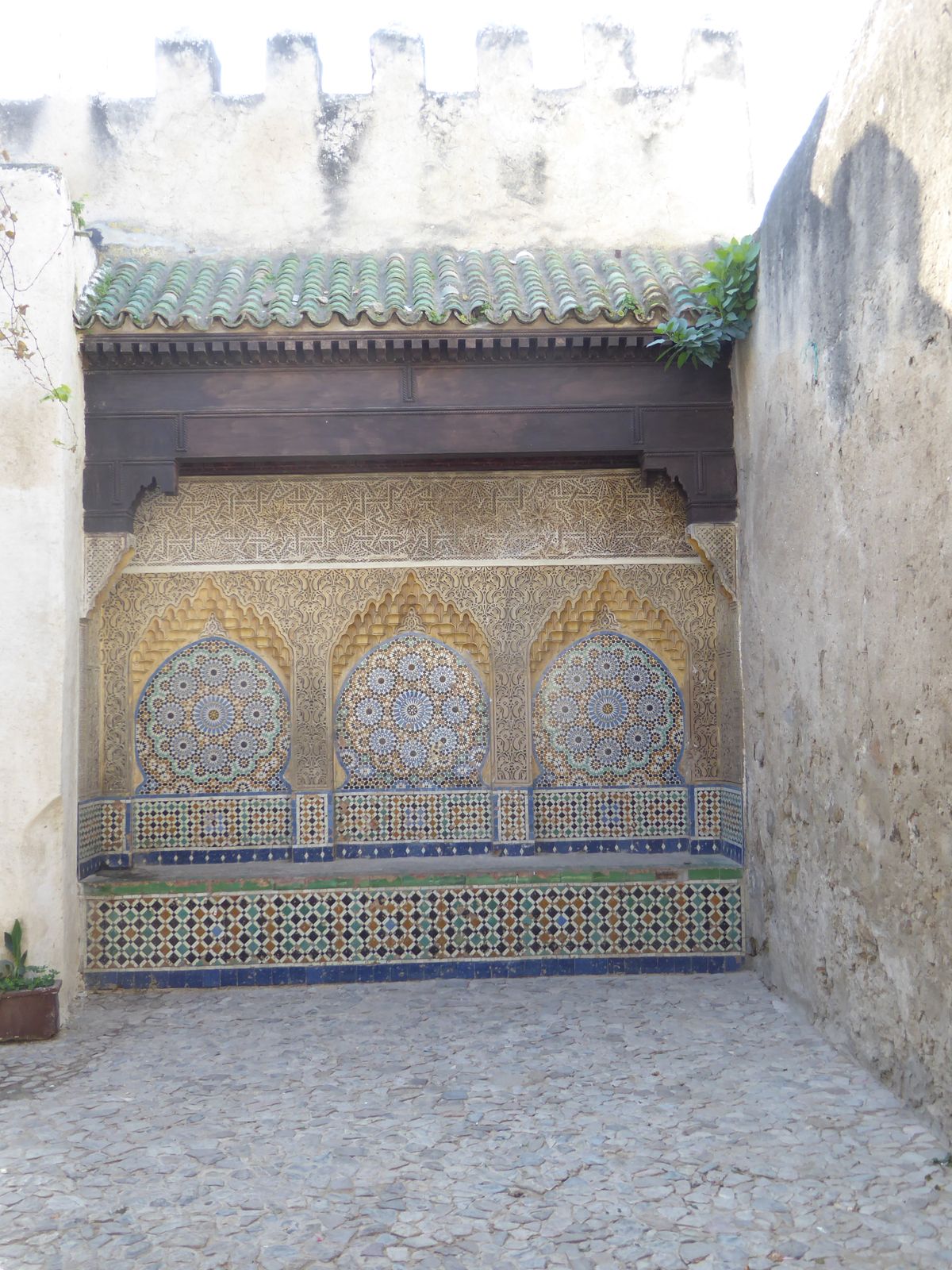 If we headed downhill from the Place du Mechouar, we'd pass this now-dry Seqaya or Fountain at the Bab el Assa. How much more appealing it w