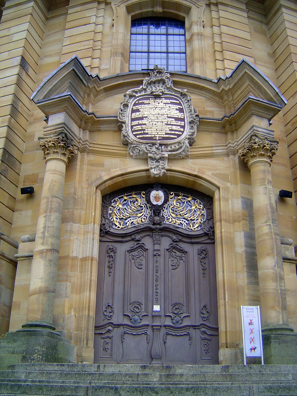 The door's locked, but come around to the side.