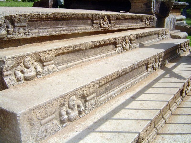 The steps are said to represent stages of purification. The supporting dwarfs are similar to those at Sanchi Peninsular India and many other