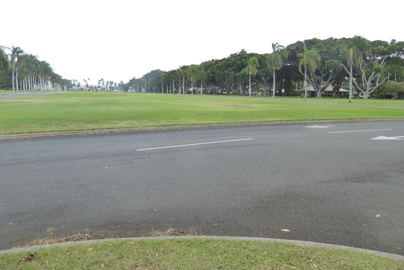 The tower stands at the toe of a parade ground separating homes for officers and enlisted. At the Far end of the lawn is the headquarters of