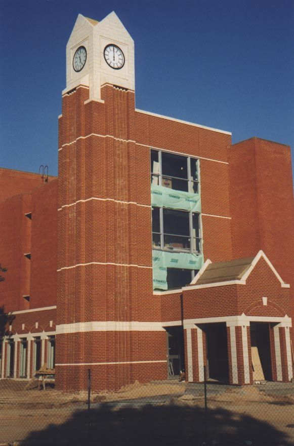 The University in 1999 put the finishing touches on a new home for its Honors College. It desperately needed a clocktower. A porte cochere w