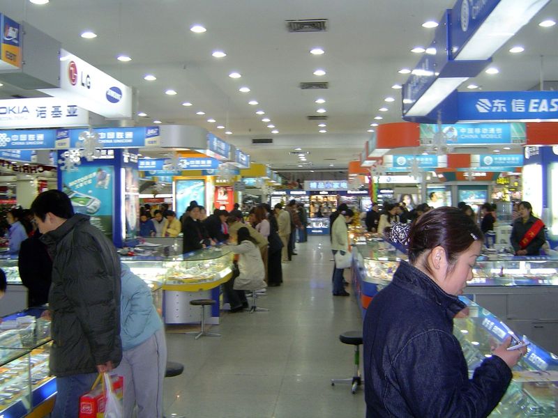 Downtown shopping district: cell phones galore. Everyone has one, or so it seems.
