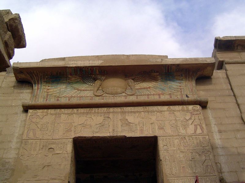 Over its door is a winged sun, symbol of Horus. Ramesses III's name appears, too, implying his divinity.
