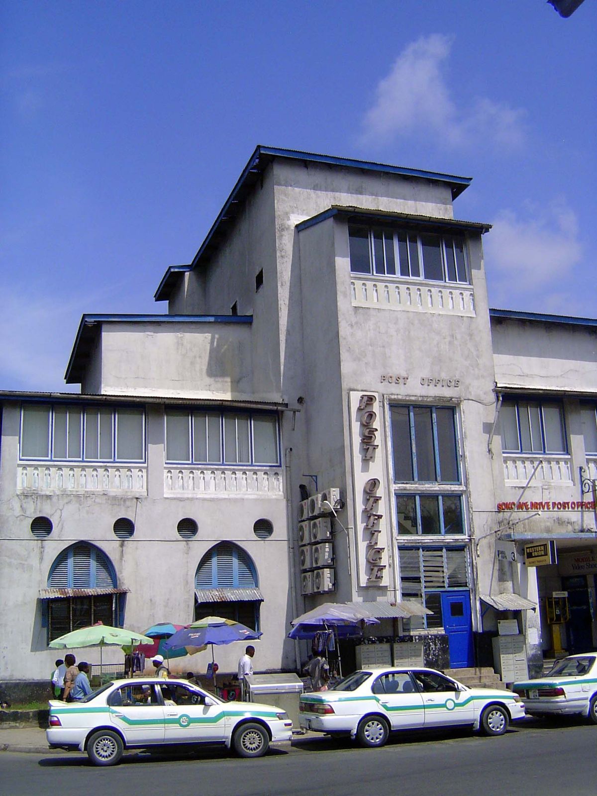 The post office was also built by the Germans, but the roof line has lost its original tiled gables, and the gray paint is somebody's idea o