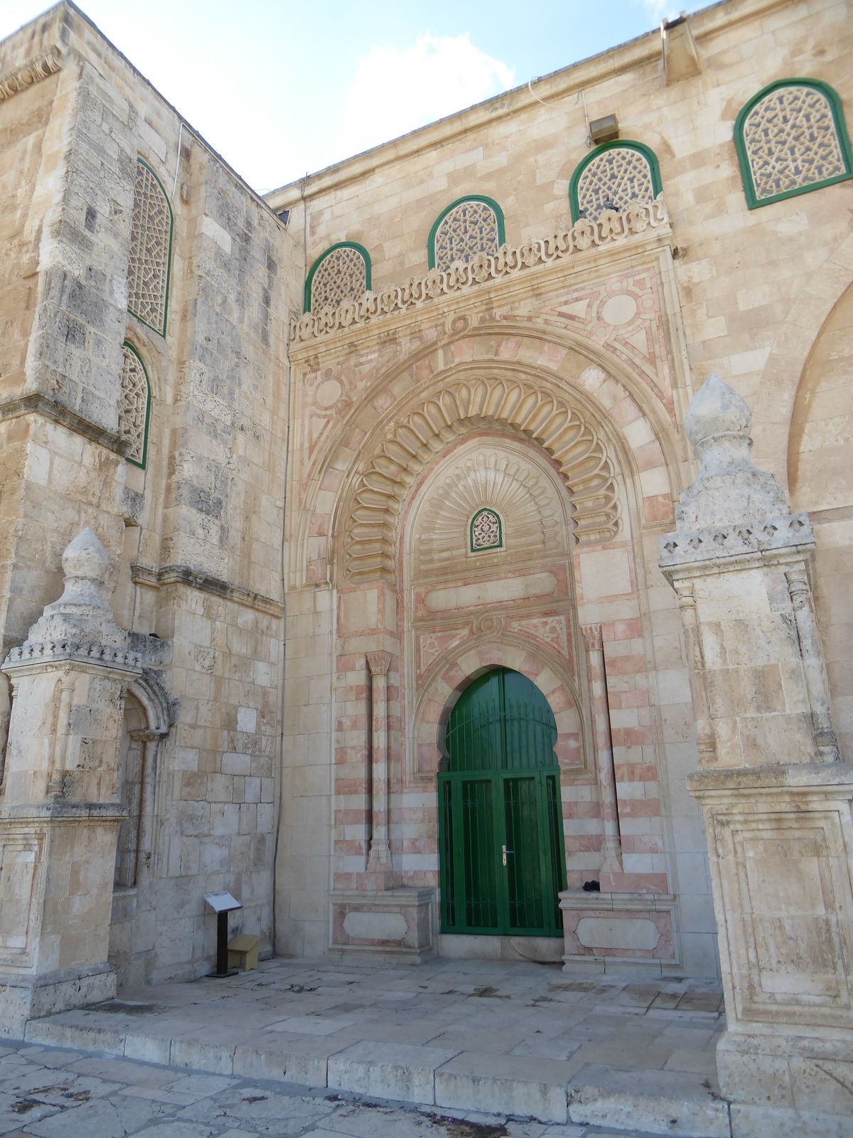 A closed door on the east side might be older than the others.