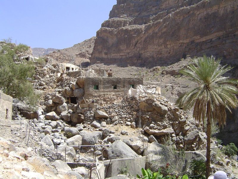 The settlement: a dozen houses, with greenery upstream and down.