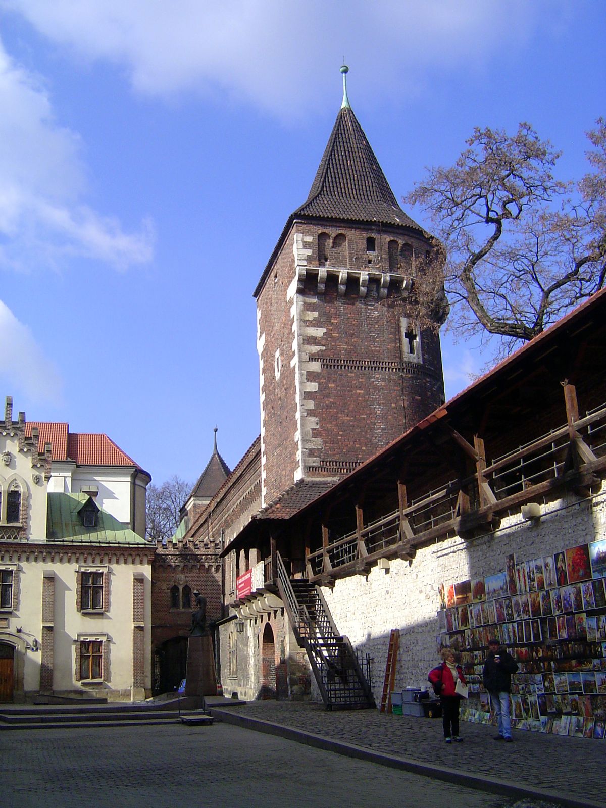 Two nearby survivors, the towers of the Carpenters and the Joiners, separated by the city's arsenal.