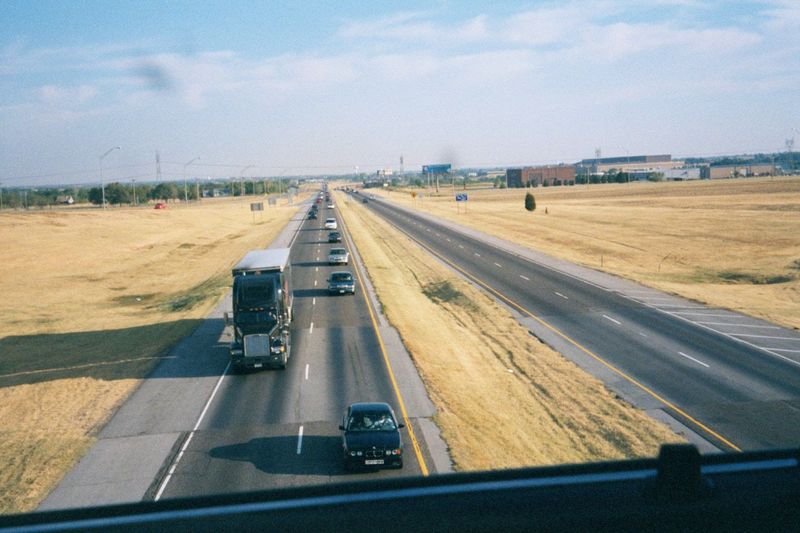A couple of miles farther up the interstate. The traffic is light, but this is Sunday morning, early. The open ground is the only gap left b