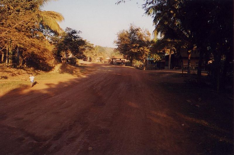 The road to Louang Prabang is circuitous. Here, a couple of miles from town, it's already unpaved—and heading in the wrong direction.