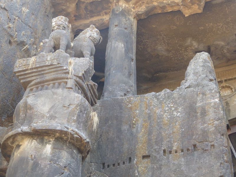 The octagonal column has a twin, but that site is now occupied by a Shiva temple, a corner of which appears in the previous picture.